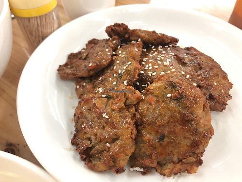 Pan-fries lotus root cakes at V+ Vegetarian Restaurant in Kowloon