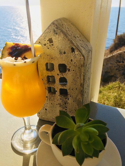 Katharos Paradise - vodka, passion fruit, pineapple and caramel pineapple decor at Katharos Lounge in Santorini