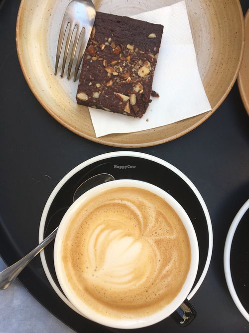 Latte with oat milk and a vegan brownie at Deep Coffee Roaster in Marseille