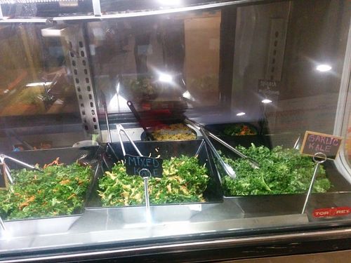 Deli case. Daily kale, lemon, garlic, plain at Sunshine's Health Food Store and Vegetarian Deli in Houston