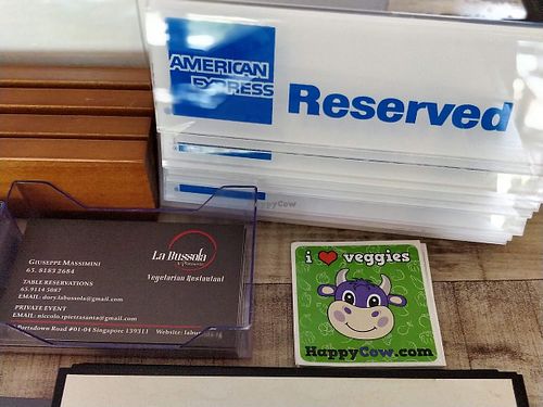 you could pick up some HappyCow green stickers from here at La Bussola in West Singapore