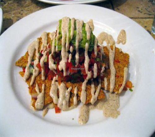 Live Nachos (Raw) with dehydrated flax seed crackers, cashew sour cream, tomato salsa, avocado. at Blossom Restaurant on Columbus in New York City