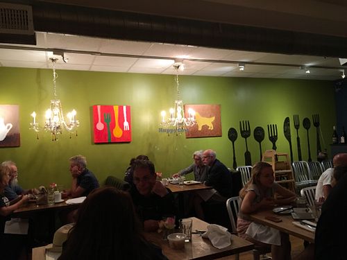 Interior with fun art work and colorful! at Green Elephant Vegetarian Bistro in Portland