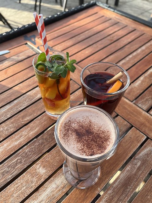pimm’s cup, warm mold wine, and an almond milk hot chocolate  at The Woodman in North London