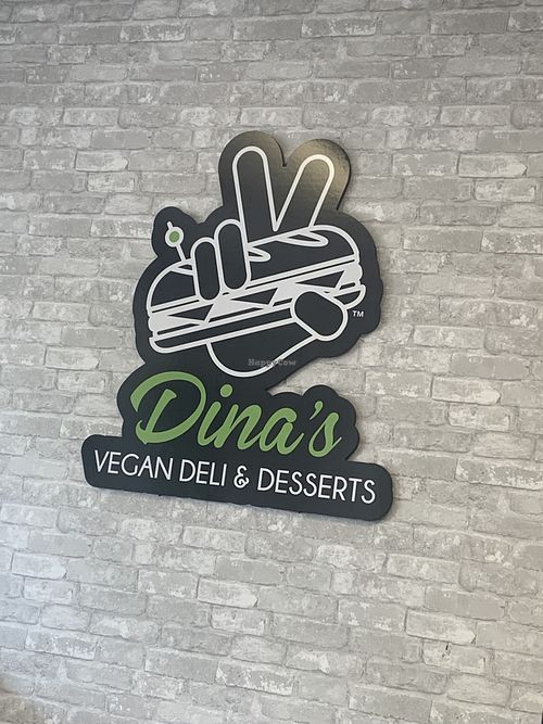 Sign at Dina's Vegan Deli & Desserts in West Palm Beach