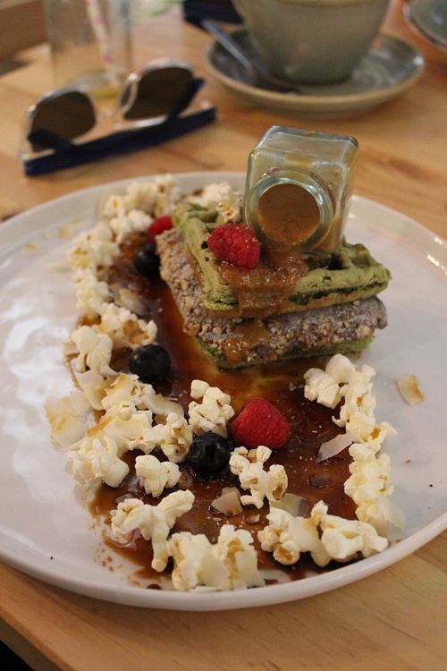 vegan matcha waffles with caramel sauce and popcorn at EatMyTrip  in Barcelona