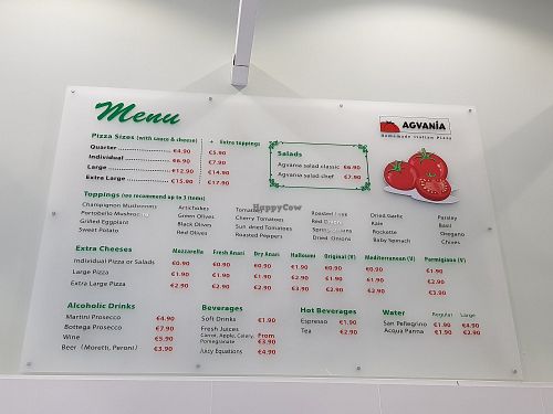 Menu on the wall, above the kitchen at Agvania Pizza in Limassol