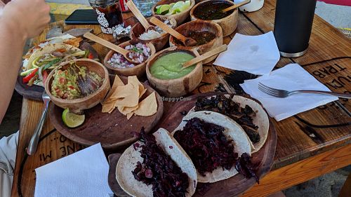Salsa, guac, and one of each vegan tacos. at El Itacate in Sayulita