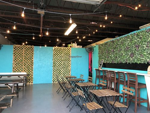 Indoor seating area with fans at Mission Kitchen - Food Truck in Orlando