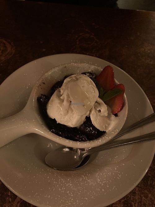 Vegan chocolate cake with vegan ice cream! at Otro Cinco in Syracuse