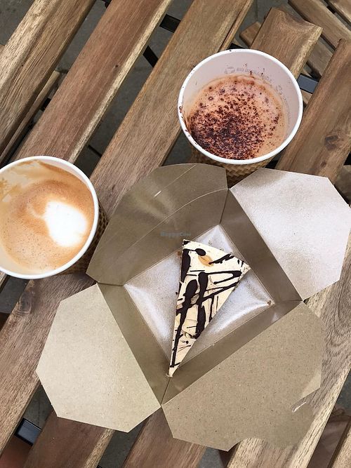 Take to the beach! Amazing coffee and raw vegan snickers cheesecake! 😋🌱 (Also gluten free!) at Sprout at The Yard in Perranporth