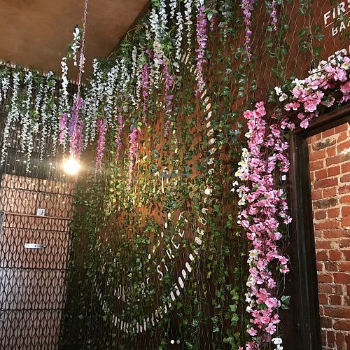 Beautiful decor, there's flowers EVERYWHERE  at Hell Below in Carlisle