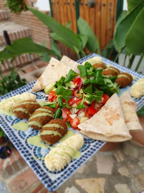 falafel pieces, hummus, mint tahini sauce, fresh salad, and homemade flatbread at Meson Mudejar in Archez