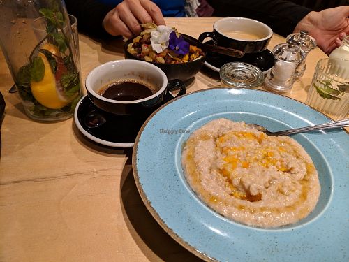 Acai bowl, latte with oat milk, triple shot americano, porridge with jam. at Urbanity in Dublin