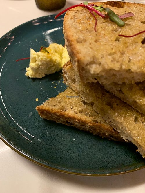 Bread with cultured coconut butter  at Kanu Cafe - Doppio Zero Pizza in Edmonton