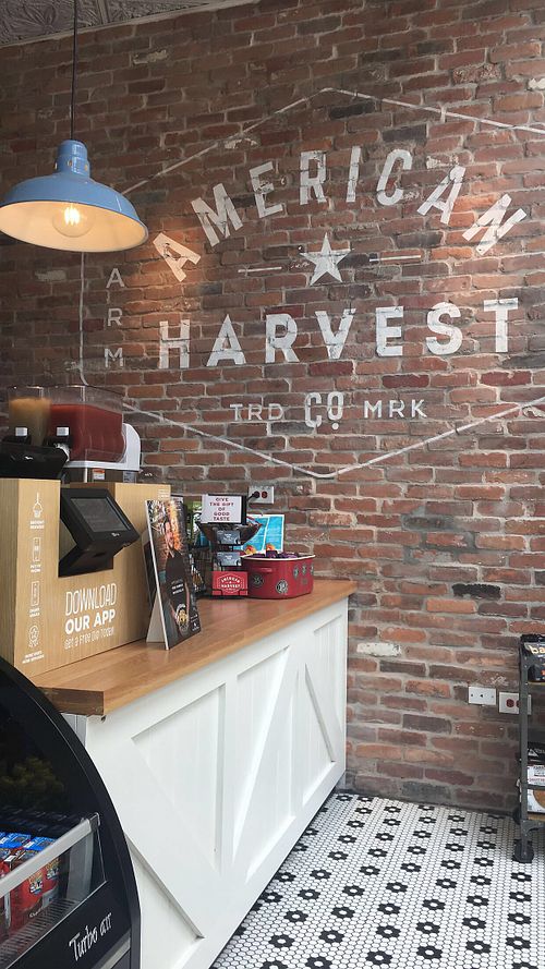 Cute wall by the counter!  at American Harvest Co in Miami