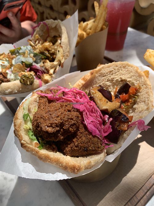 The falafel added to a veggie pita and seasoned fries. 😋 at Brassica in Bexley