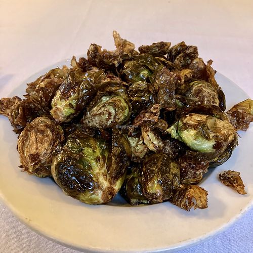 Crispy Brussels sprout in truffle oil (order without bacon and Gorgonzola dressing) - WAY too much oil on these things.  at Grounds Restaurant in Murphys