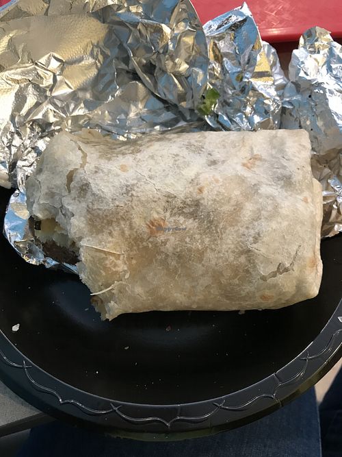 Side view of vegan Cali burrito with azada meat at Guapo's Taco Shop in Bakersfield