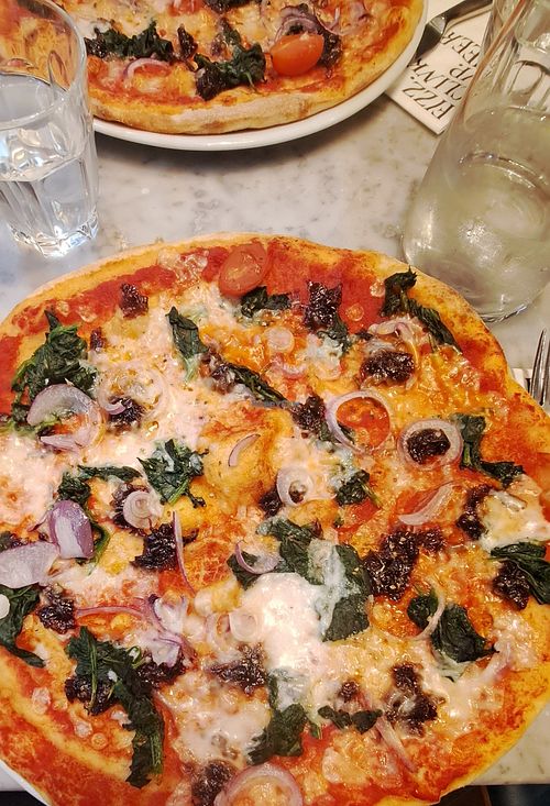 Caramelised onion and spinach pizza at Pizza Express in Renfrew