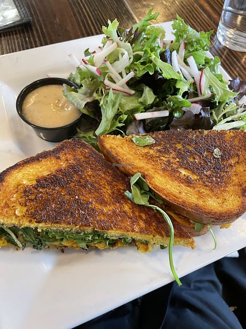 Curry cauliflower sandwich with salad and shallot dressing  at ERIS Brewery and Cider House in Chicago