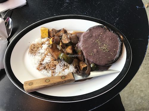 Portobello Cap filled with Black Bean and sautéed zucchini and squash on rice at The Artists' Kava House in Tallulah Falls