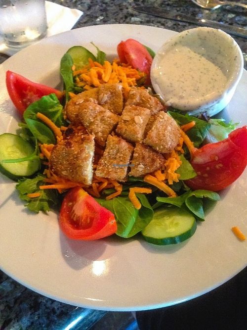 Favorite! Crispy Chickun Salad
Baby spinach and mixed spring greens topped with crispy chickun, tomatoes, cheddar cheese, cucumbers, carrots and red onions. Drizzled with your choice of Ranch or Agave Mustard dressing. $10.95 Regular Only at Ethos Vegan Kitchen in Winter Park