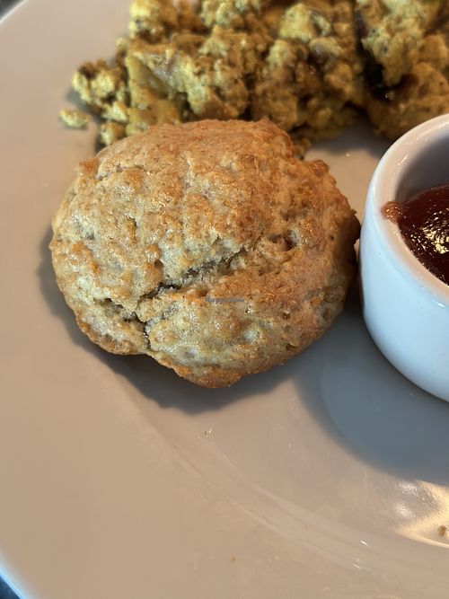 Biscuit, small, hard & flat. Scramble, over seasoned 🤢  at Ethos Vegan Kitchen in Winter Park