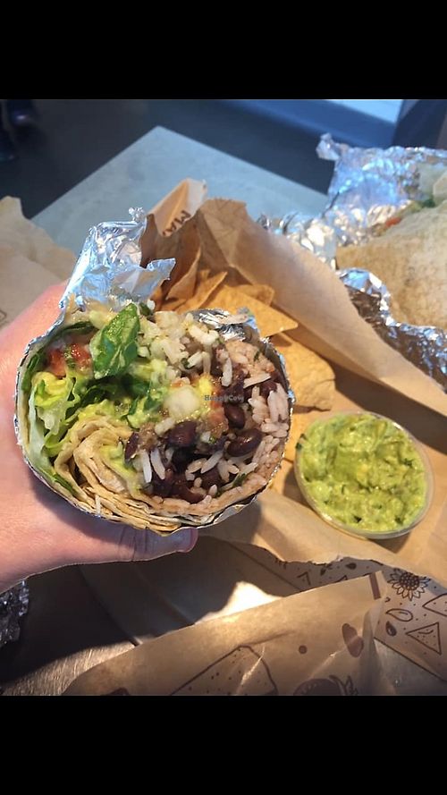 Veggie burrito with chips n guac   at Chipotle - E Cactus Rd in Phoenix