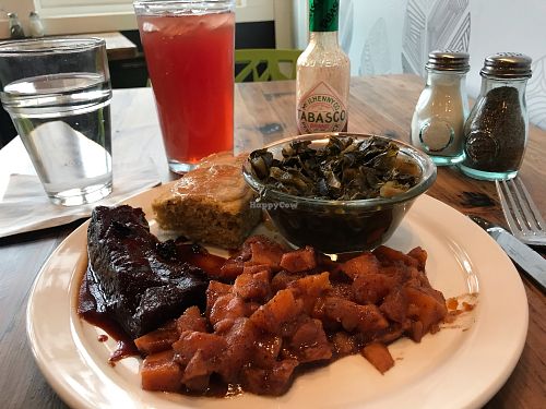 Soul food platter - sweet potatoes, bbq ribs, collards, corn bread at Trio Plant-Based in Minneapolis