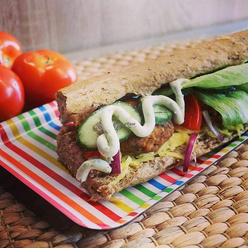 Sandwich with tofu burgers, vegan cheese, garlic and nettle sauce, pickles and red onion at Długa Buła in Torun