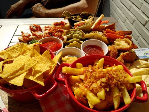 Vegan tapas (2 persons). Delicious! Fries, vegan fried cheese, dim sum, sweet potato..... at Groenendijk Weert in Weert