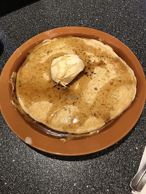 Old fashioned vegan pancake topped with vegan butter and maple syrup  at Batter Up Pancakes in Fresno