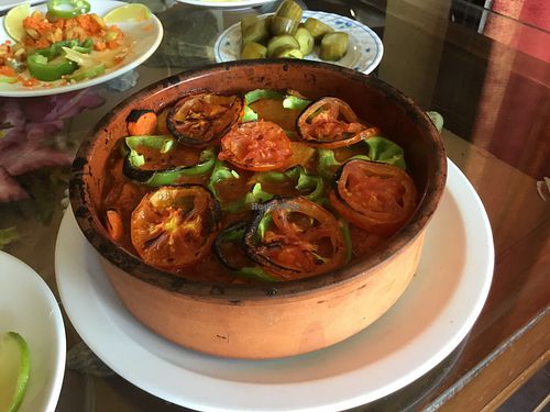 Seniya of potatoes, onions and green peppers served in clay pot at Syrian Palace in Aqaba
