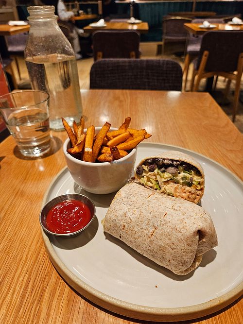 9 layer burrito and fries at Fresh Kitchen & Juice Bar in Toronto