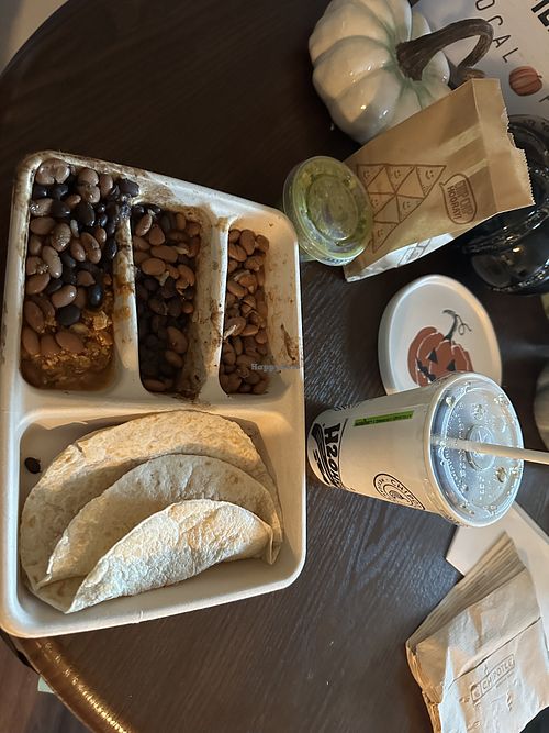 Kids meal (comes with chips and a drink) got the sofritas, black beans, pinto beans, and a side of guac (for a charge).   at Chipotle in Lake Grove