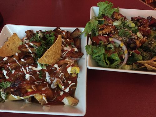 Poutine and salad with extra tempeh  at Neue Republik Reger in Berlin