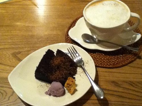 Chocolate cake, ice cream and cappuchino. Absolutely delicious! The cake is perfect and they have a lot of different vegan ice cream flavours. at Aoi Sora Organic Cafe in Sapporo