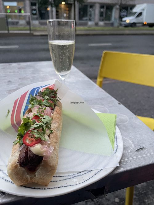Still the same - colourful neighborhood bar with nice vegan options. And kitchen is open quite late. - This is vegan hot dog in the photo    at Bar Favela in Helsinki