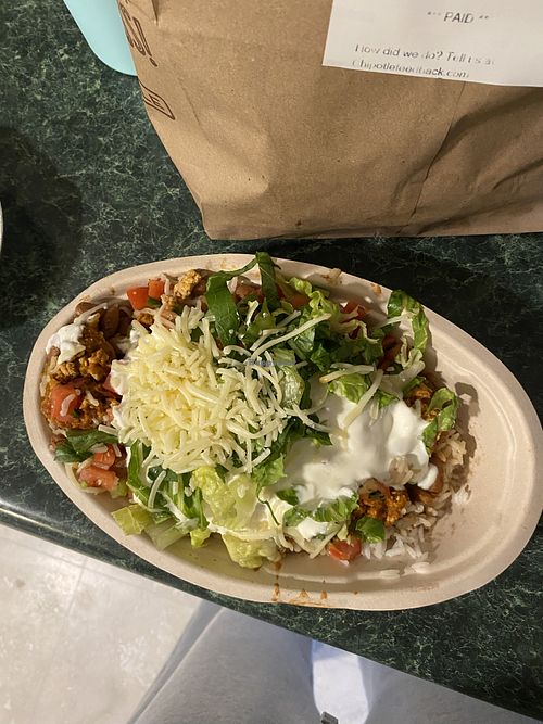 Did not ask for cheese or sour cream for this orderr  at Chipotle in Camp Hill