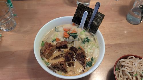 Udon noodle bowl with coconut curry broth and house made seitan at Yum Yum Noodle Bar in Red Hook