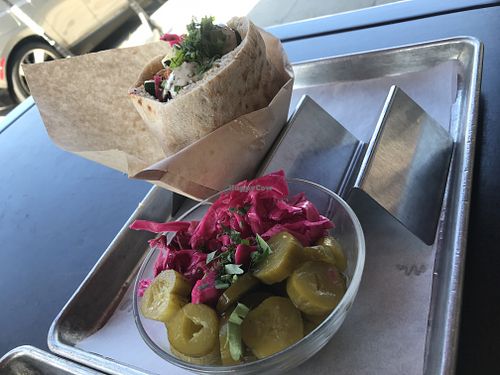 Pickles and falafel pita sandwich at Hasiba in Los Angeles
