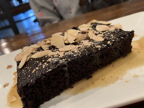 Decadent chocolate cake with almonds and caramel...soooo good! at O'cado in Sherman Oaks