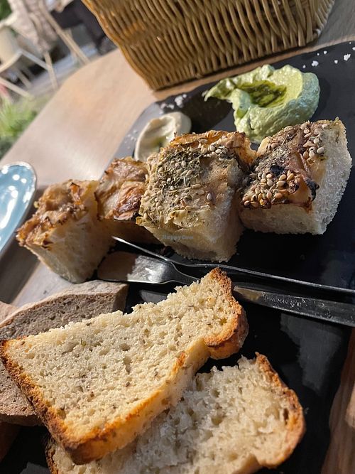 The toasted bread was tasty, but the pâté and cheese was a great combo; and a tasty polenta as well. at Orteá - Vegan Collective in Lisbon