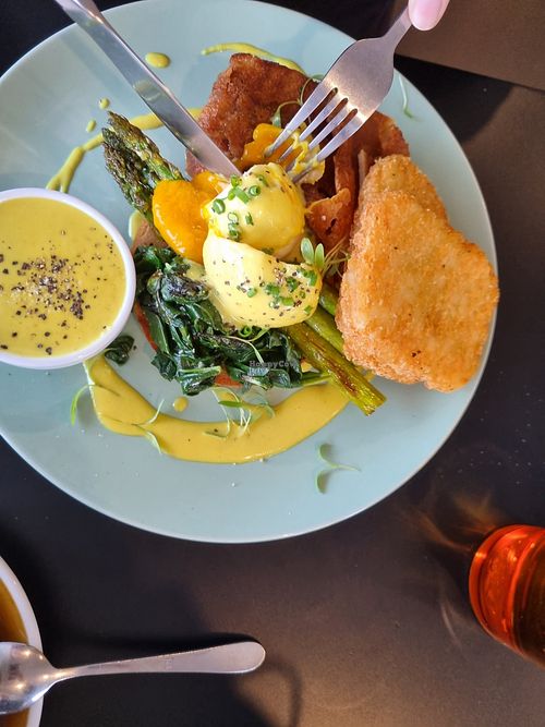 Benny with poached eggs and hash browns at Crux in Semaphore