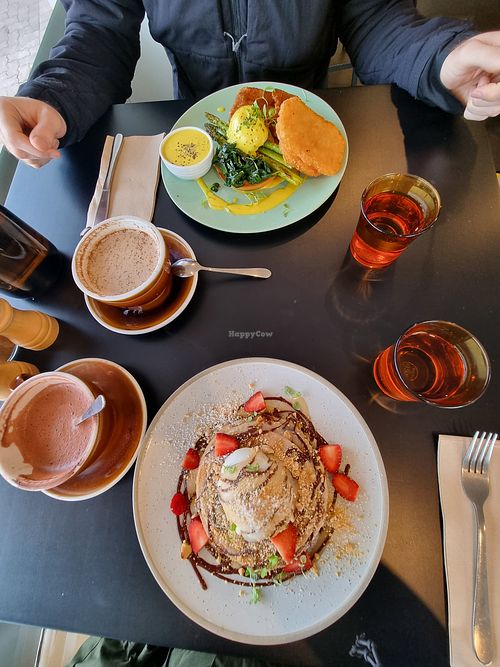 Front: S'Mores Pancakes, hot chocolate (sweet) Back: Benny with poached eggs and hash browns, chai tea at Crux in Semaphore