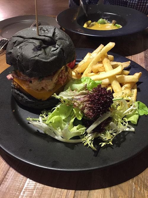 Vegan crab burger (charcoal bread) with side salad and fries at POP vegan in Hong Kong Island