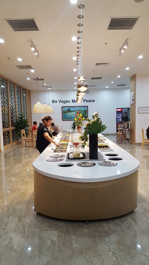 Buffet area, hot served Pho on the right corner at Loving Hut - Hoa Sen in Hanoi