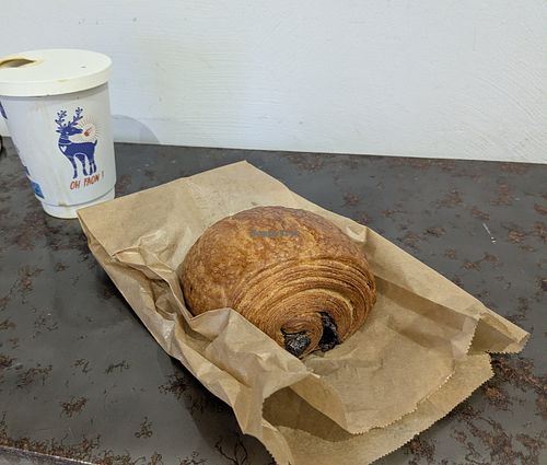 Pain au chocolat and latte in all-paper to-go cup. ❤️ at Oh Faon in Marseille