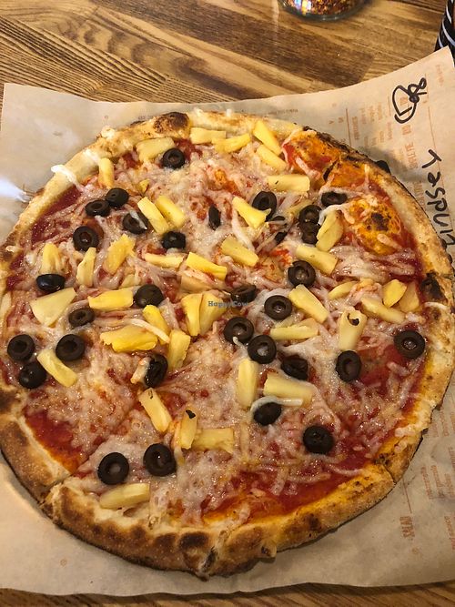 Vegan “cheese” with black olives and pineapples.  Delicious!  at Mod Pizza - Anderson Mill in Austin